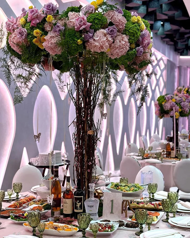 Colorful floral centerpiece and banquet dining table at Avana Venue