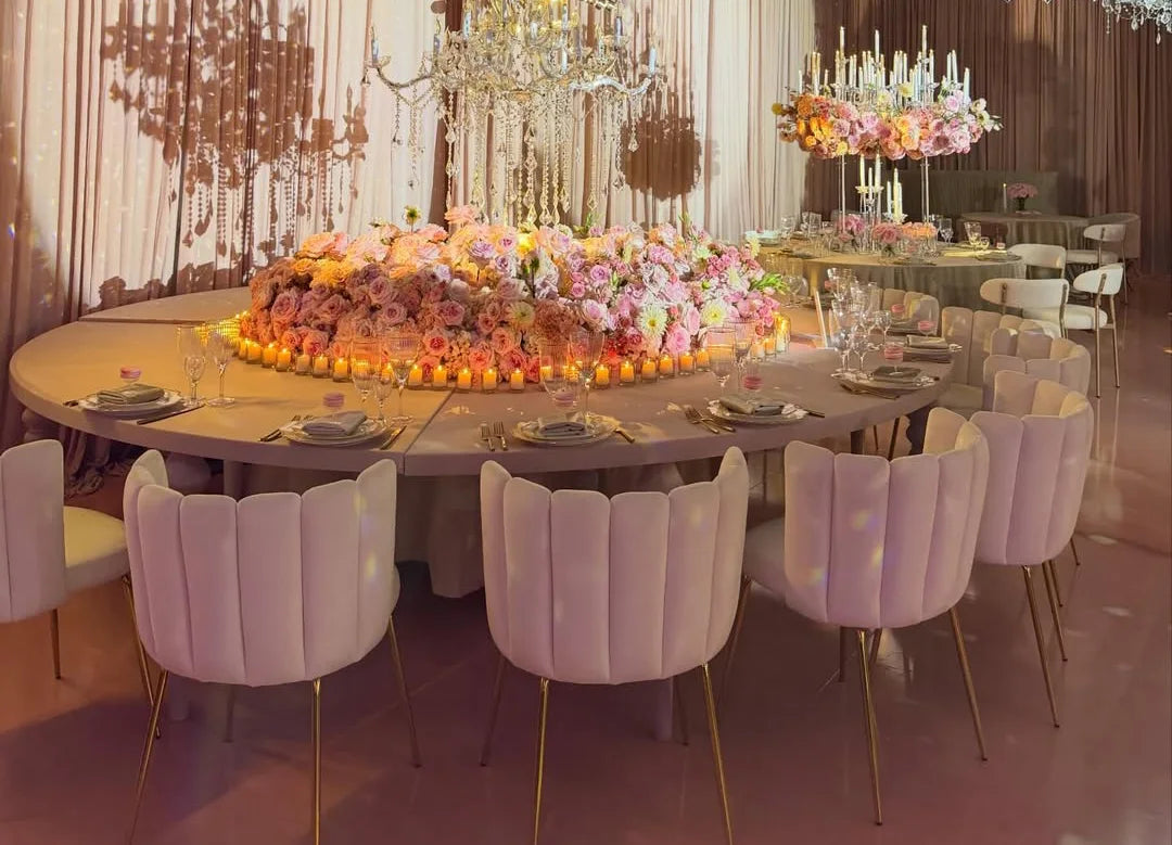 A table with flowers and candles.