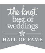 Gray badge with white text that reads, "the knot best of weddings HALL OF FAME," with a star separating "weddings" and "hall of fame.