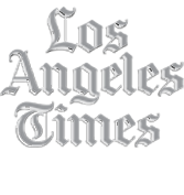 The Los Angeles Times logo in an ornate, gothic-style font, displayed in gray text on a light background.